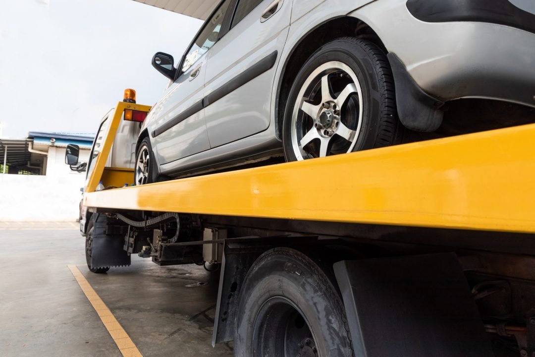 broken-car-on-flatbed-tow-truck-being-transported-for-repair.jpg broken-car-on-flatbed-tow-truck-being-transported-for-repair.jpg