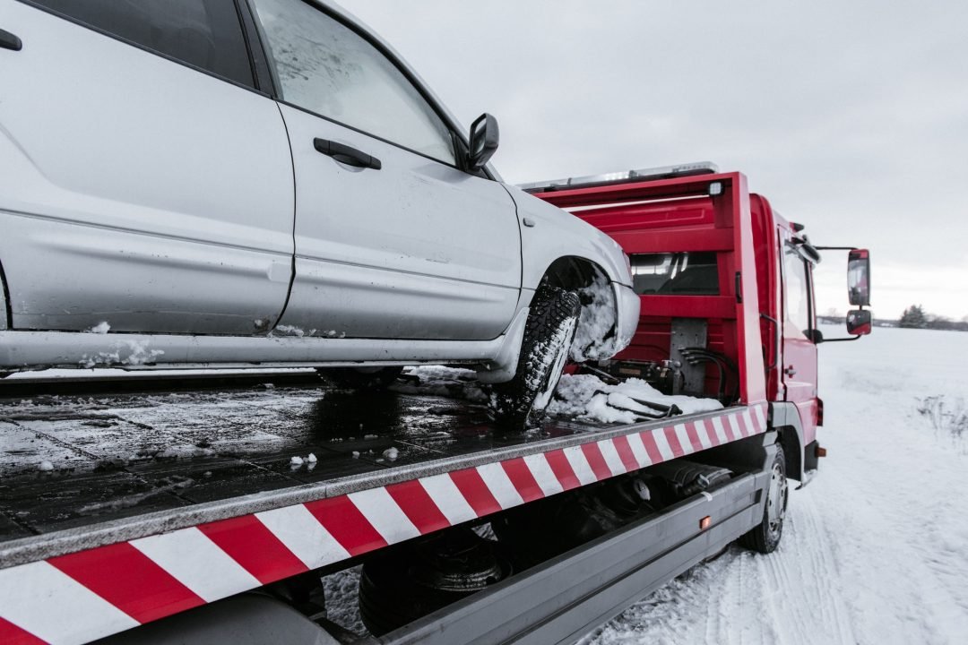 car-on-tow-truck-on-snow-road.jpg car-on-tow-truck-on-snow-road.jpg