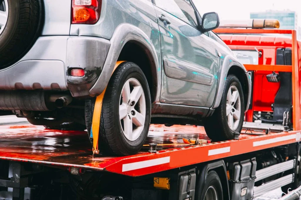 A small jeep being towed on a truck for reliable car towing service in Tinley Park, IL.