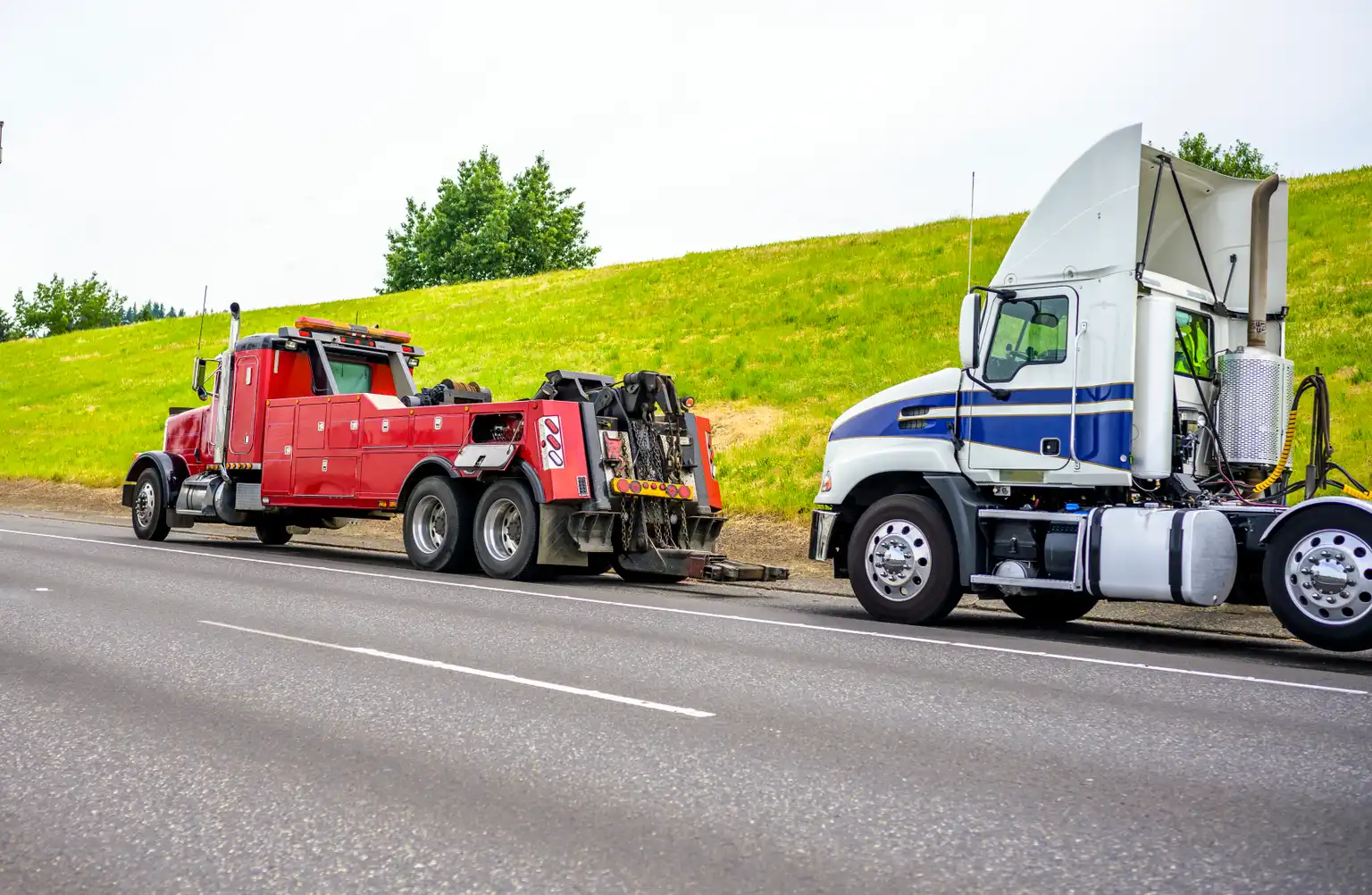 Two semi trucks parked on the roadside awaiting auto recovery services in Alsip,IL. Two semi trucks parked on the roadside awaiting auto recovery services in Alsip,IL.