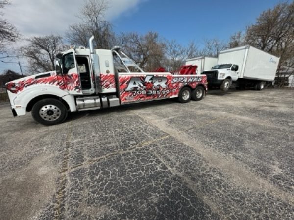 Truck towing another truck for towing service in Burbank, IL.