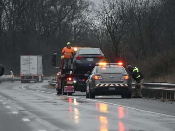 Two cars parked on the roadside awaiting emergency tow truck for vehicle recovery services in Crestwood,IL.