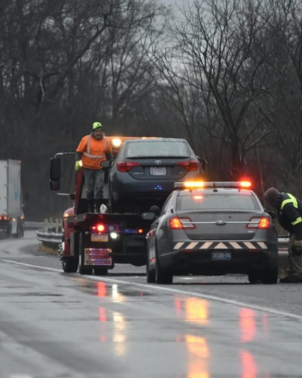 Two cars parked on the roadside awaiting emergency tow truck for vehicle recovery services in Crestwood,IL.